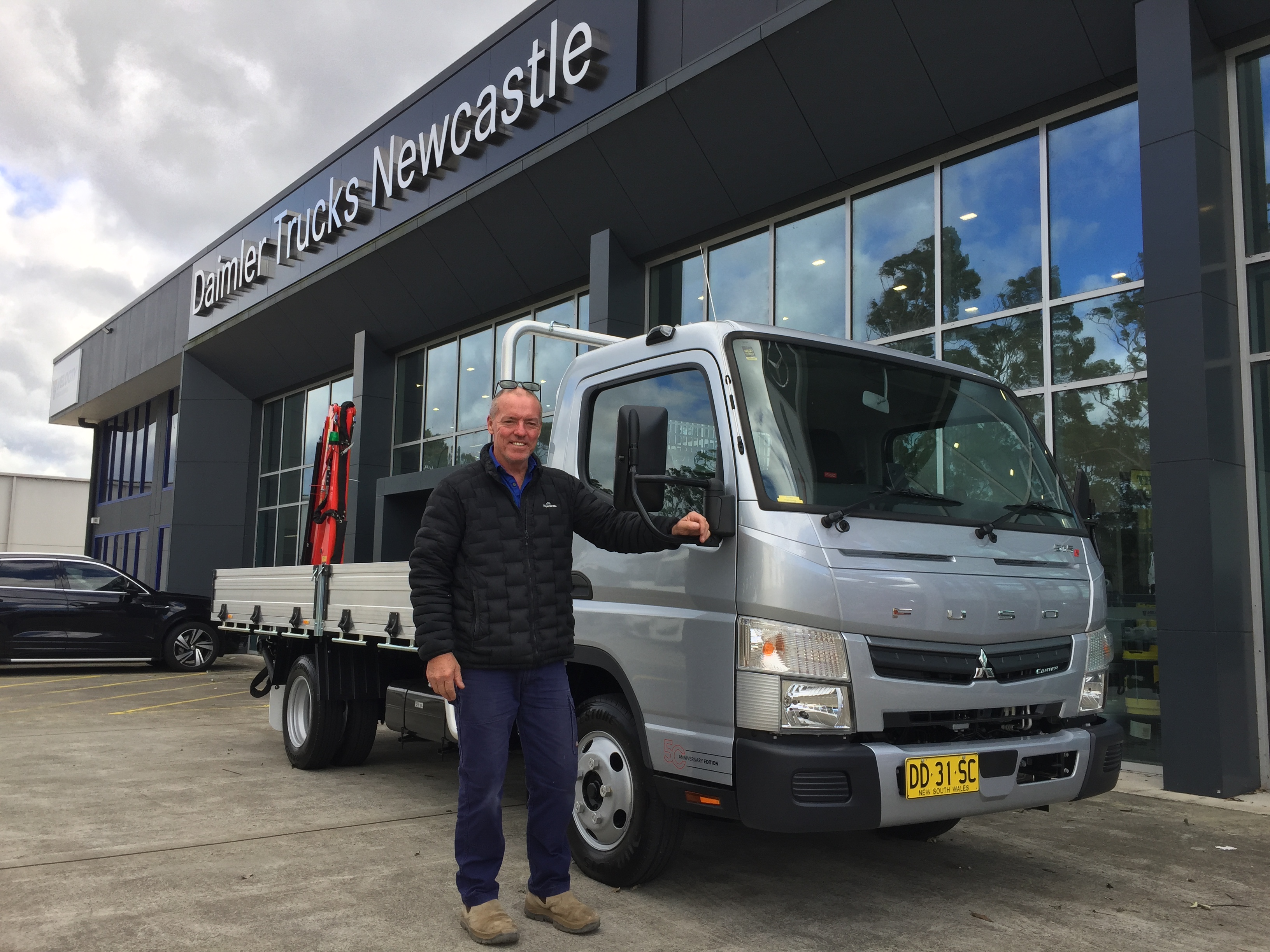 Fuso Canter 515 with a rear Palfinger crane